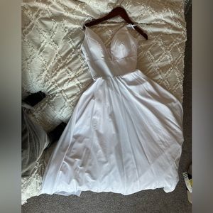 A line never worn Wedding Dress. Color is bright white.